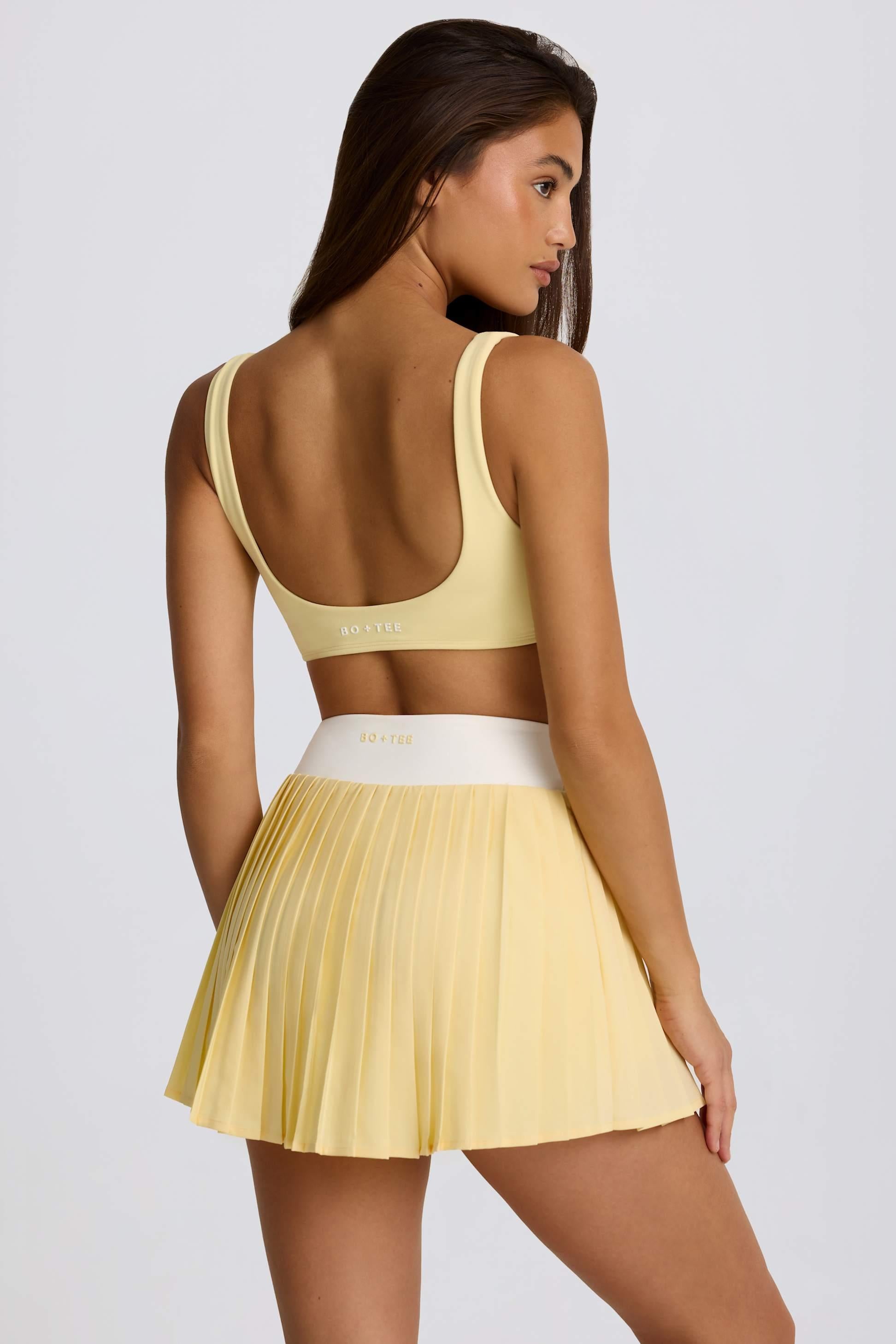 Soft Active Crossover Pleated Mini Skort In Lemon